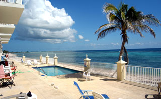 The seaside pool and sundeck off the beachfront condos -- one of two pools and decks at Turtle Nest Inn & Condos, Grand Cayman (TNI Photo)